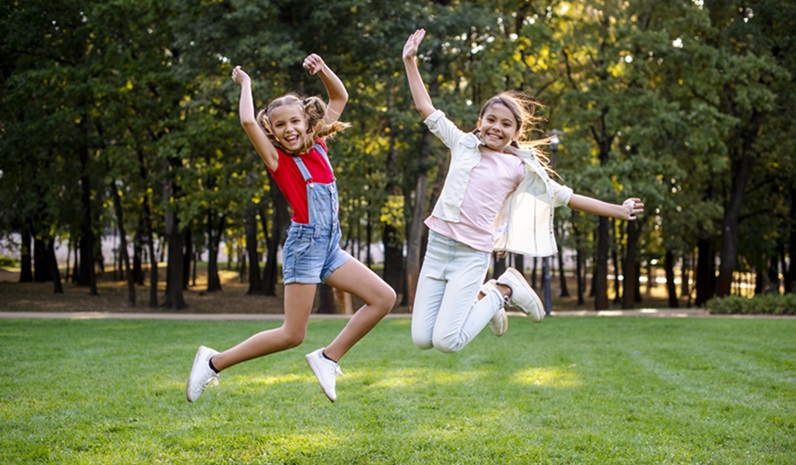 Front View Girls Jumping Park