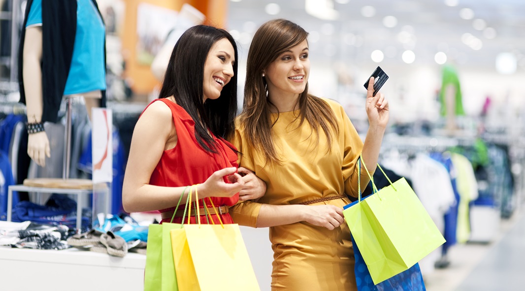 Two Girlfriends With Shopping Bags