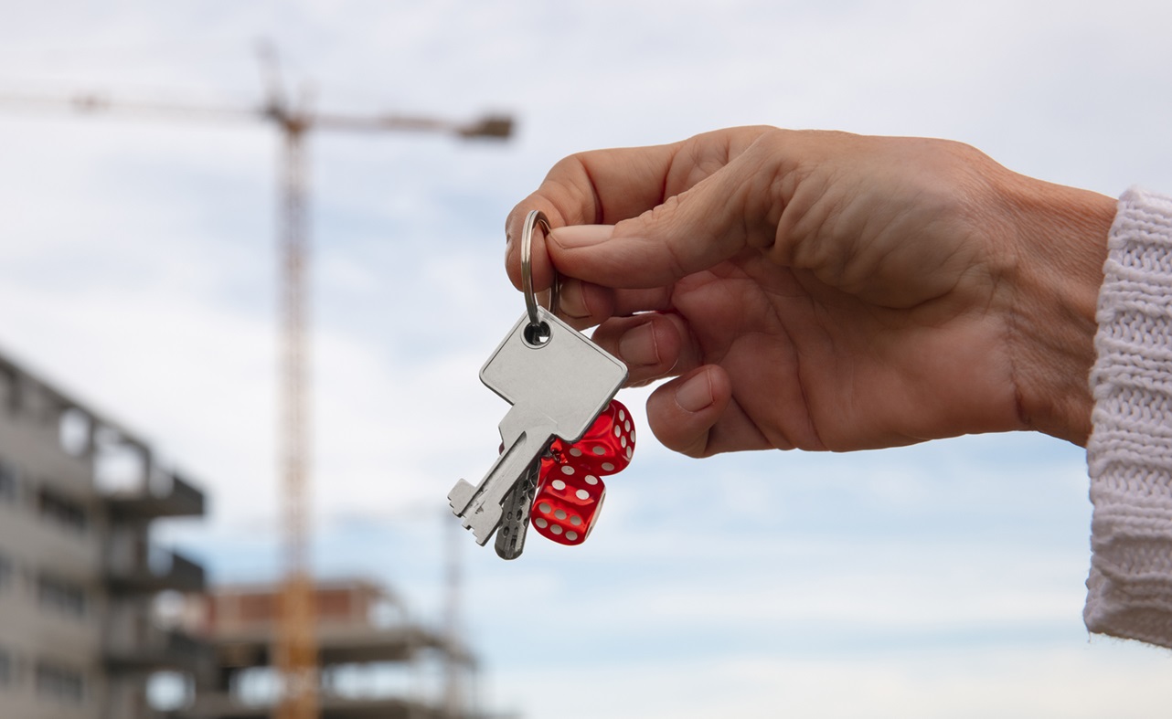 Hand Holding Keys Outdoors